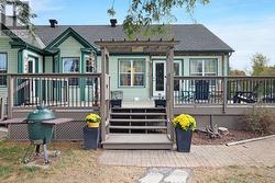 DECK OFF SUN AND LIVING ROOM AREA - 