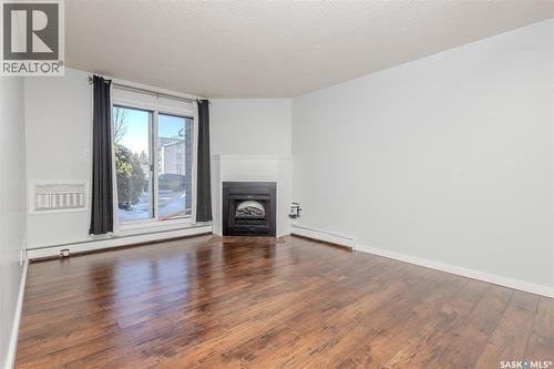 112 203 Tait Place, Saskatoon, SK - Indoor Photo Showing Living Room With Fireplace