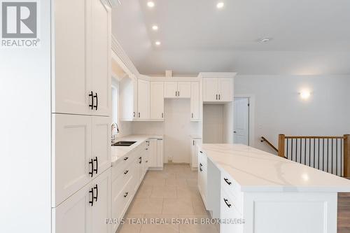 50 Breithaupt Crescent, Tiny, ON - Indoor Photo Showing Kitchen With Double Sink