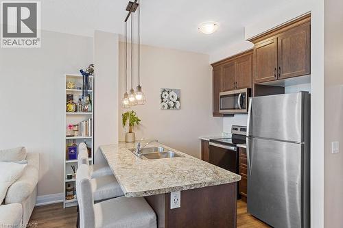 16 Concord Place Unit# 705, Grimsby, ON - Indoor Photo Showing Kitchen With Double Sink