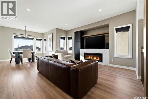 13 Plains Green, Pilot Butte, SK - Indoor Photo Showing Living Room With Fireplace