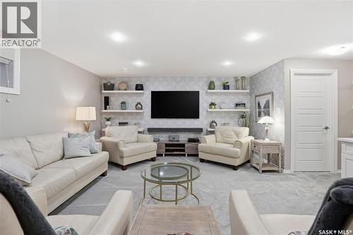 341 4000 Sandhill Crescent, Regina, SK - Indoor Photo Showing Living Room With Fireplace