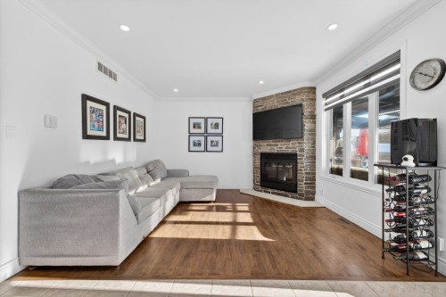 Salon - 107 Rue Thibert, Saint-Constant, QC - Indoor Photo Showing Living Room With Fireplace