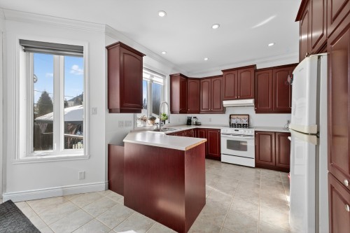 Cuisine - 107 Rue Thibert, Saint-Constant, QC - Indoor Photo Showing Kitchen With Double Sink