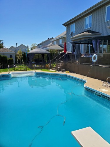 Face arrière - 107 Rue Thibert, Saint-Constant, QC - Outdoor With In Ground Pool With Deck Patio Veranda With Backyard