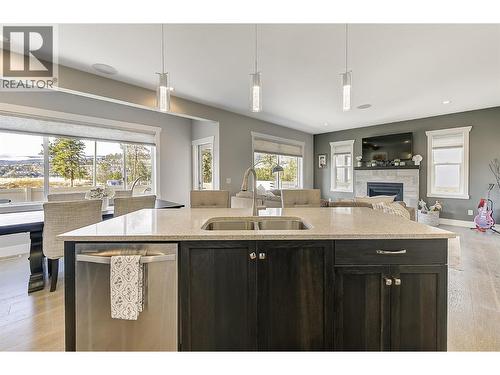 3082 Riesling Way, West Kelowna, BC - Indoor Photo Showing Kitchen With Fireplace With Double Sink