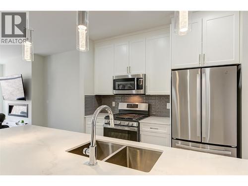 Kitchen - 1164 Black Mountain Drive, Kelowna, BC - Indoor Photo Showing Kitchen With Stainless Steel Kitchen With Double Sink With Upgraded Kitchen