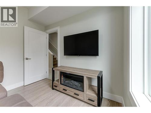 Den (lower level) - 1164 Black Mountain Drive, Kelowna, BC - Indoor With Fireplace