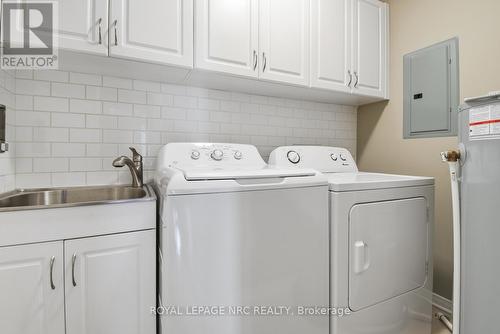 Spacious Laundry Rm with sink & side-by-side appl. - 203 - 16 Sullivan Avenue, Thorold (Thorold Downtown), ON - Indoor Photo Showing Laundry Room