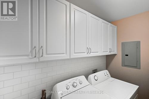 Laundry Rm with upper cabinets & backsplash - 203 - 16 Sullivan Avenue, Thorold (Thorold Downtown), ON - Indoor Photo Showing Laundry Room