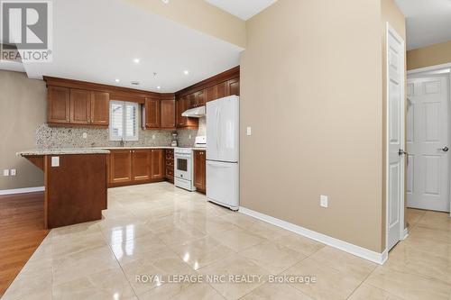 Custom Kitchen with stone counters and backsplash - 203 - 16 Sullivan Avenue, Thorold (Thorold Downtown), ON - Indoor Photo Showing Kitchen