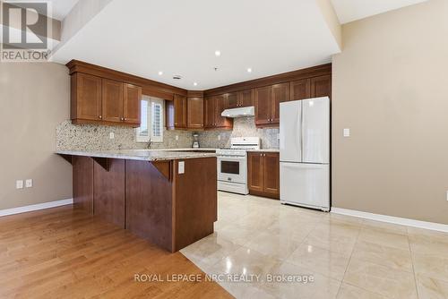 Oversized breakfast bar & seating for 4 - 203 - 16 Sullivan Avenue, Thorold (Thorold Downtown), ON - Indoor Photo Showing Kitchen