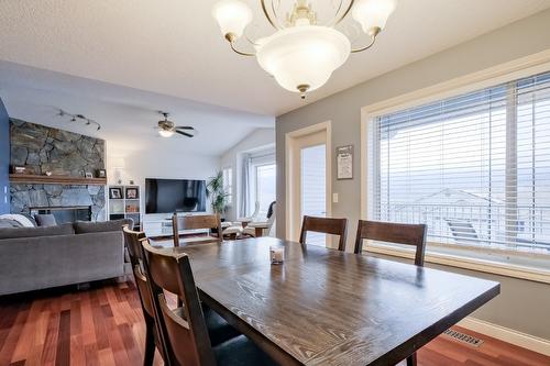 1410 Kendra Court, Kelowna, BC - Indoor Photo Showing Other Room With Fireplace
