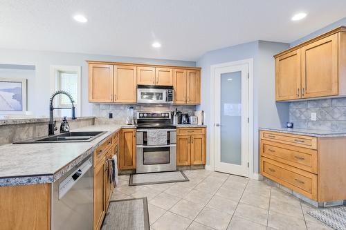 1410 Kendra Court, Kelowna, BC - Indoor Photo Showing Kitchen With Double Sink
