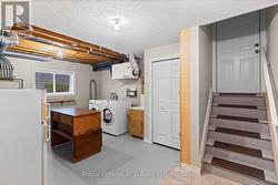 large utility room with walk-out to the garage - 