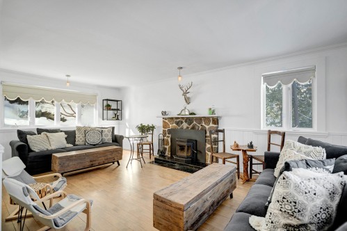 Salon - 291 Ch. De La Corniche, Piedmont, QC - Indoor Photo Showing Living Room With Fireplace