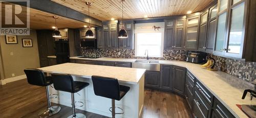 Loads of quality cabinets - 15 Squires Road, Eastport, NL - Indoor Photo Showing Kitchen With Double Sink