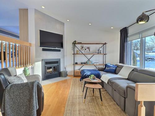 Living room - 57  - 57A 47E Avenue, Saint-Eustache, QC - Indoor Photo Showing Living Room With Fireplace