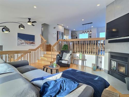 Living room - 57  - 57A 47E Avenue, Saint-Eustache, QC - Indoor Photo Showing Living Room With Fireplace
