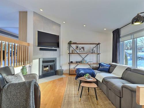 Living room - 57  - 57A 47E Avenue, Saint-Eustache, QC - Indoor Photo Showing Living Room With Fireplace