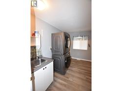 Main floor laundry with a utility sink - 