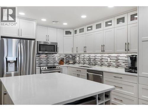 Kitchen Island with wine bar and storage - 2777 Casa Loma Road Unit# 207, West Kelowna, BC - Indoor Photo Showing Kitchen With Upgraded Kitchen
