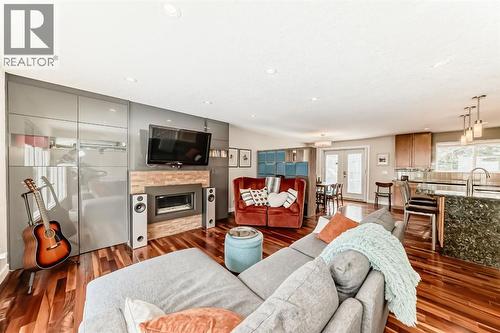 12 Varbow Place Nw, Calgary, AB - Indoor Photo Showing Living Room With Fireplace