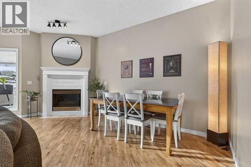 42 Hamptons Link Nw, Calgary, AB - Indoor Photo Showing Other Room With Fireplace