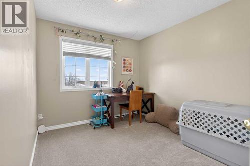 42 Hamptons Link Nw, Calgary, AB - Indoor Photo Showing Bedroom