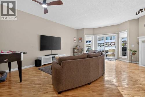 42 Hamptons Link Nw, Calgary, AB - Indoor Photo Showing Living Room With Fireplace