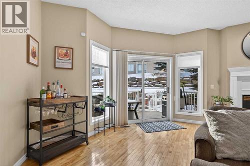 42 Hamptons Link Nw, Calgary, AB - Indoor Photo Showing Other Room With Fireplace