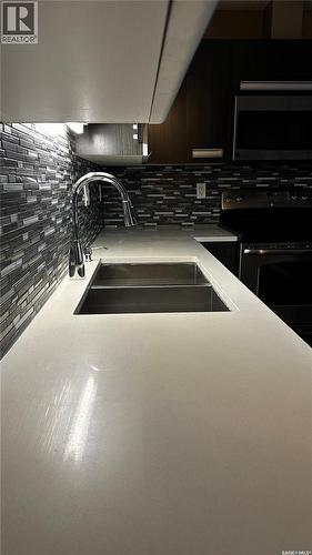 216 1510 Neville Drive, Regina, SK - Indoor Photo Showing Kitchen With Double Sink