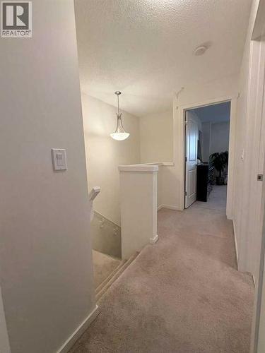 36 Evansborough Common Nw, Calgary, AB - Indoor Photo Showing Other Room