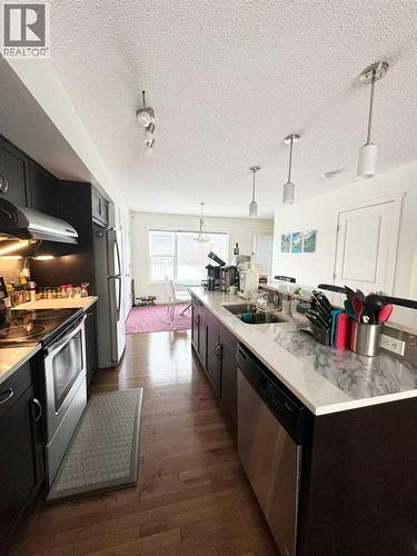 36 Evansborough Common Nw, Calgary, AB - Indoor Photo Showing Kitchen With Stainless Steel Kitchen With Double Sink With Upgraded Kitchen