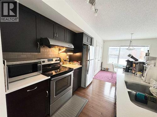 36 Evansborough Common Nw, Calgary, AB - Indoor Photo Showing Kitchen With Stainless Steel Kitchen