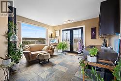 Dedicated office space featuring in floor heating and peekaboo lake views. A comfortable and quiet work from home setup that can also function as a flex room. - 