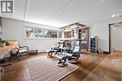 Large lower level family room offering excellent space for movie nights, games, and fun.  Warm flooring and flexible layout make it ideal for multiple uses. - 