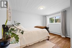 Another generously sized bedroom offering flexibility for children, guests, or additional workspace. - 