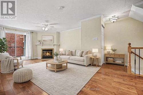 Living Room Virtually Staged - 207 Mart Circle, Ottawa, ON - Indoor Photo Showing Living Room With Fireplace