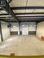 Garage featuring metal wall - 