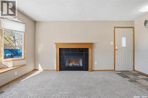 39 Peart Crescent, Regina, SK - Indoor Photo Showing Living Room With Fireplace