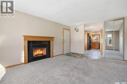 39 Peart Crescent, Regina, SK - Indoor Photo Showing Living Room With Fireplace