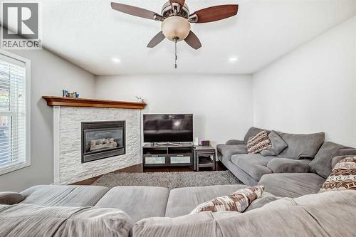 574 Chaparral Drive Se, Calgary, AB - Indoor Photo Showing Living Room With Fireplace