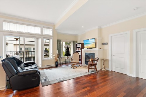 303-9942 Third St, Sidney, BC - Indoor Photo Showing Living Room With Fireplace