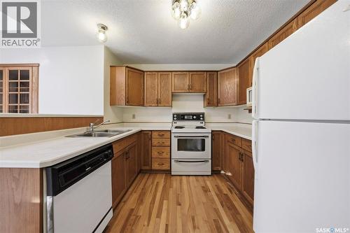 110 Cowley Road, Saskatoon, SK - Indoor Photo Showing Kitchen With Double Sink