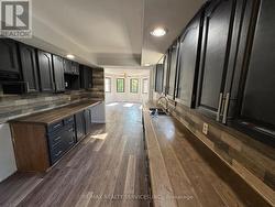 Galley Style Kitchen With Backsplash - 