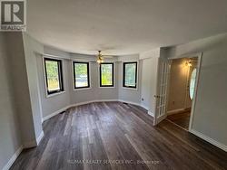 Living Room w/ Vinyl Floor and Wrap Around Windows - 