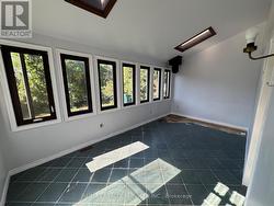 Sunroom Overlooking Backyard With Chimney - 