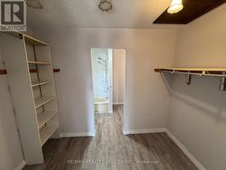 6 x 10 - Primary Bedroom Walk Through Closet - 