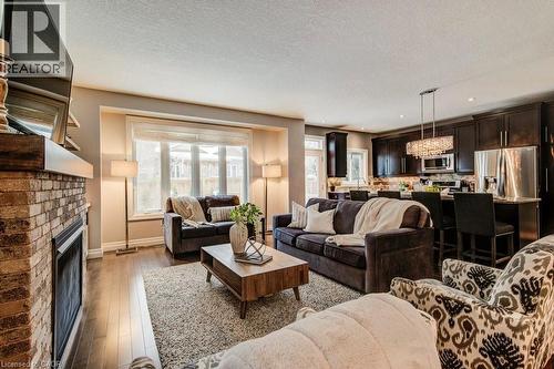 58 Eden Oak Trail, Kitchener, ON - Indoor Photo Showing Living Room With Fireplace